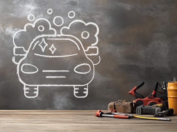 Garage with tools and a chalkboard wall.